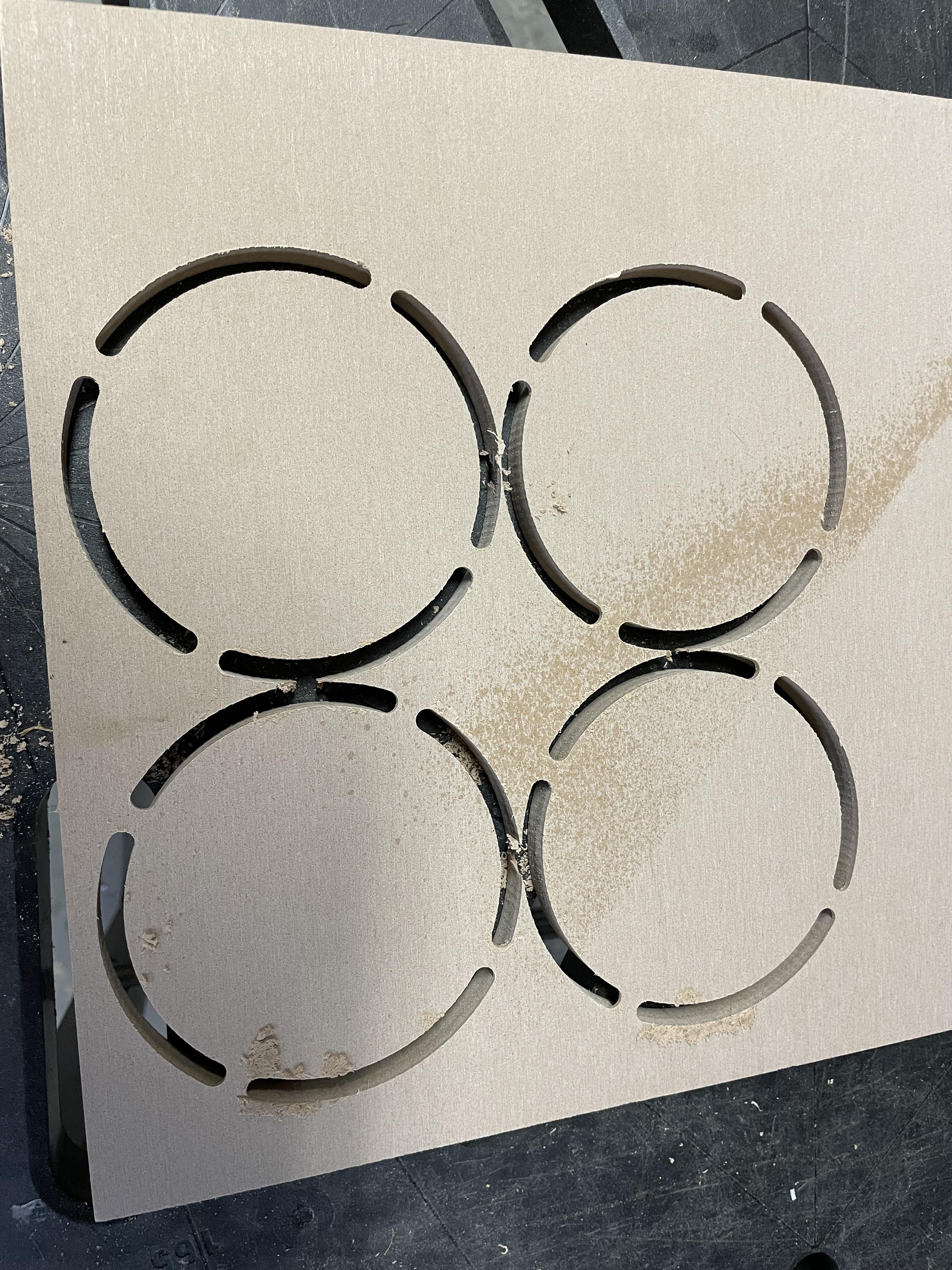 Tabs hold coasters in place while cutting on X-Carve Pro CNC