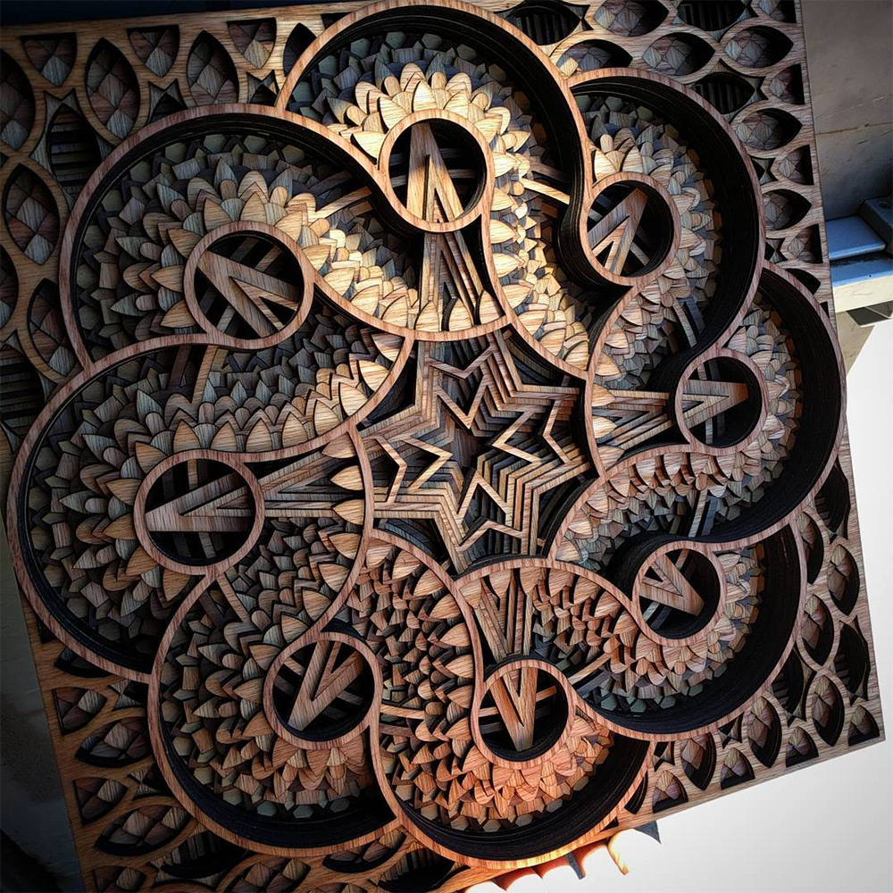 Laser-cut mahogany plywood sculptures are hypnotic