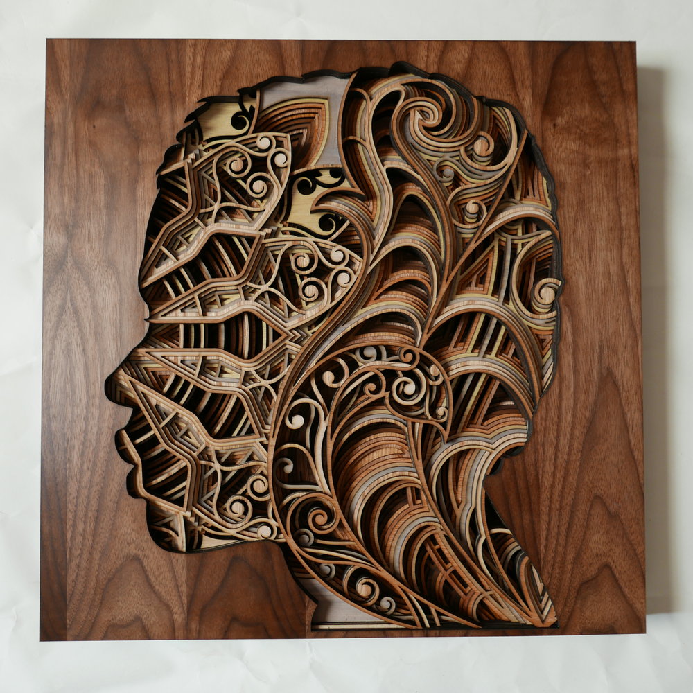 Laser-cut mahogany plywood sculptures are hypnotic