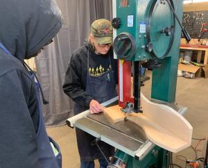 Wendy Taylor demonstrating cutting on a bandsaw.