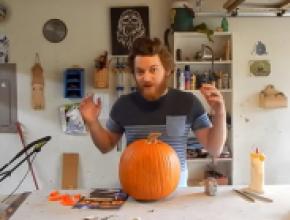 Woodworker Caleb Means carving a pumpkin