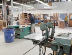 Man using jointer in Thos. Moser plant 
