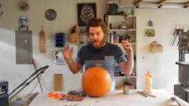 Woodworker Caleb Means carving a pumpkin