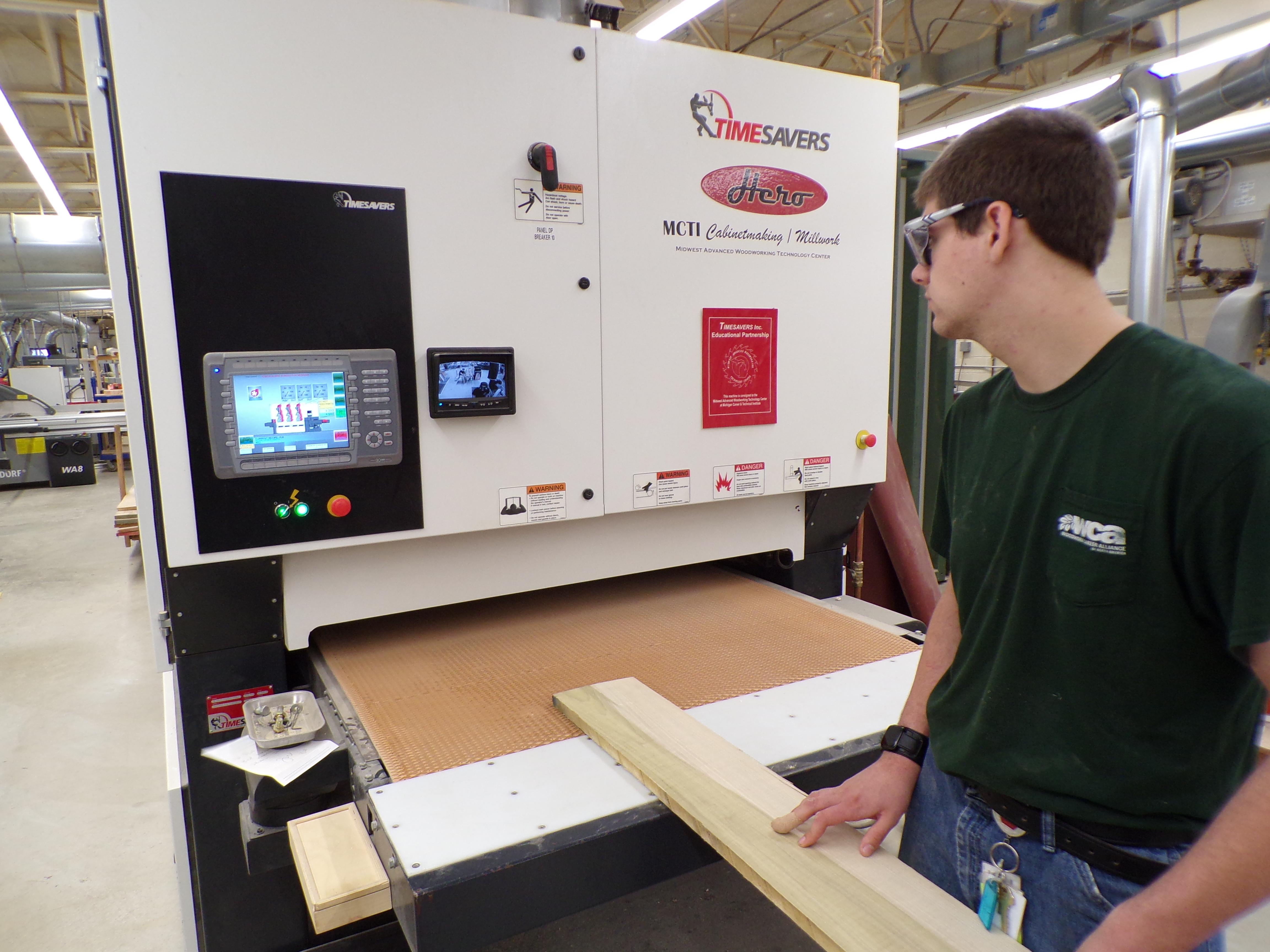 mcti_student_works_with_sander.jpg
